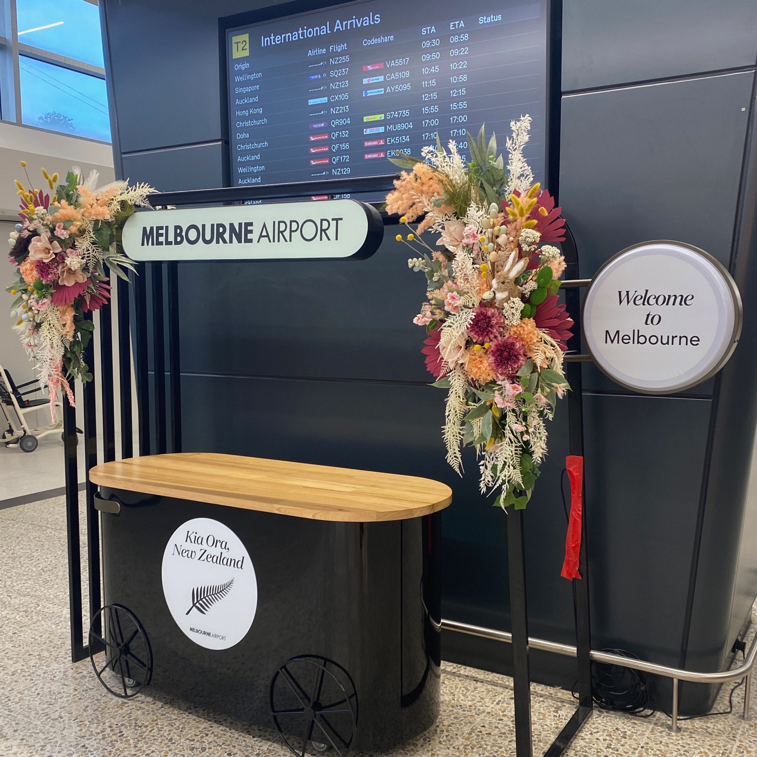 Vinyl decals welcoming travellers from New Zealand, installed onto cart at Melbourne Airport